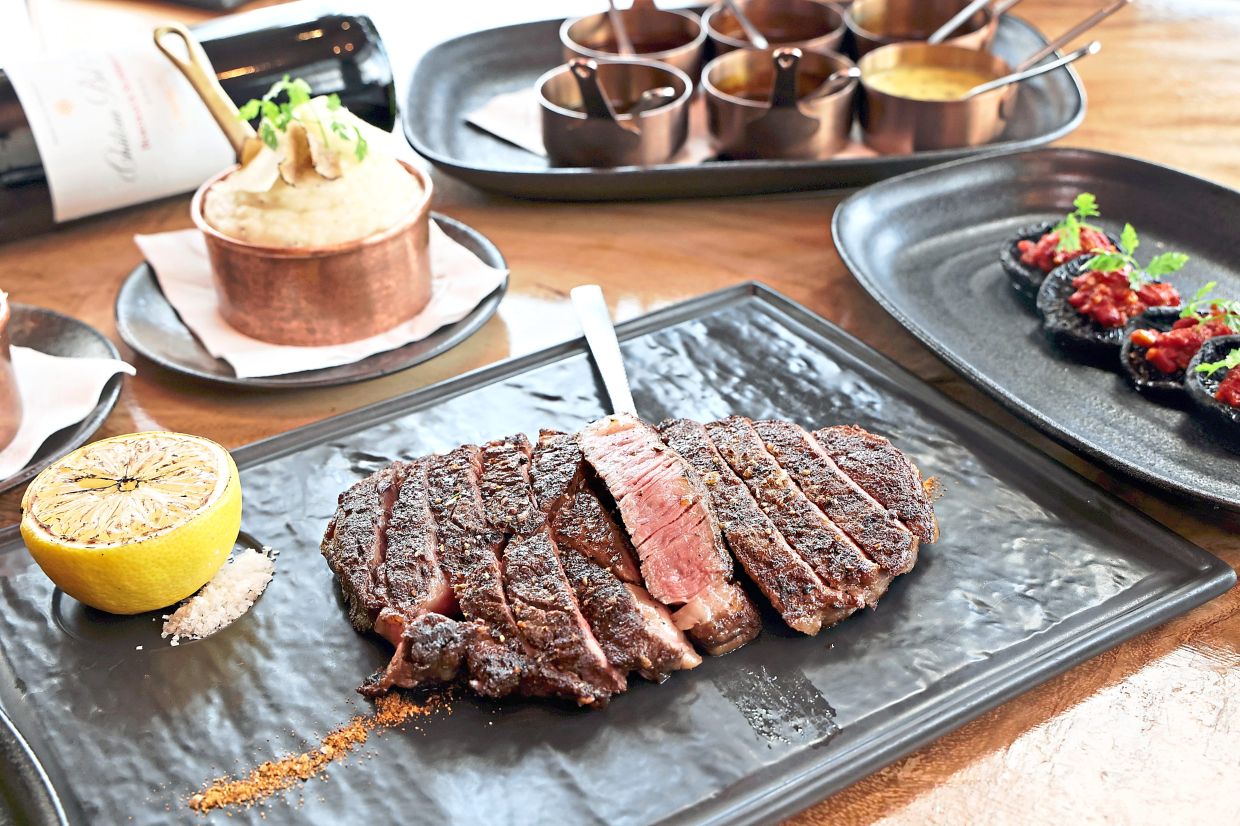 The wet-aged black Angus Cajun ribeye delivers intense flavours and incredibly juicy, succulent meat.