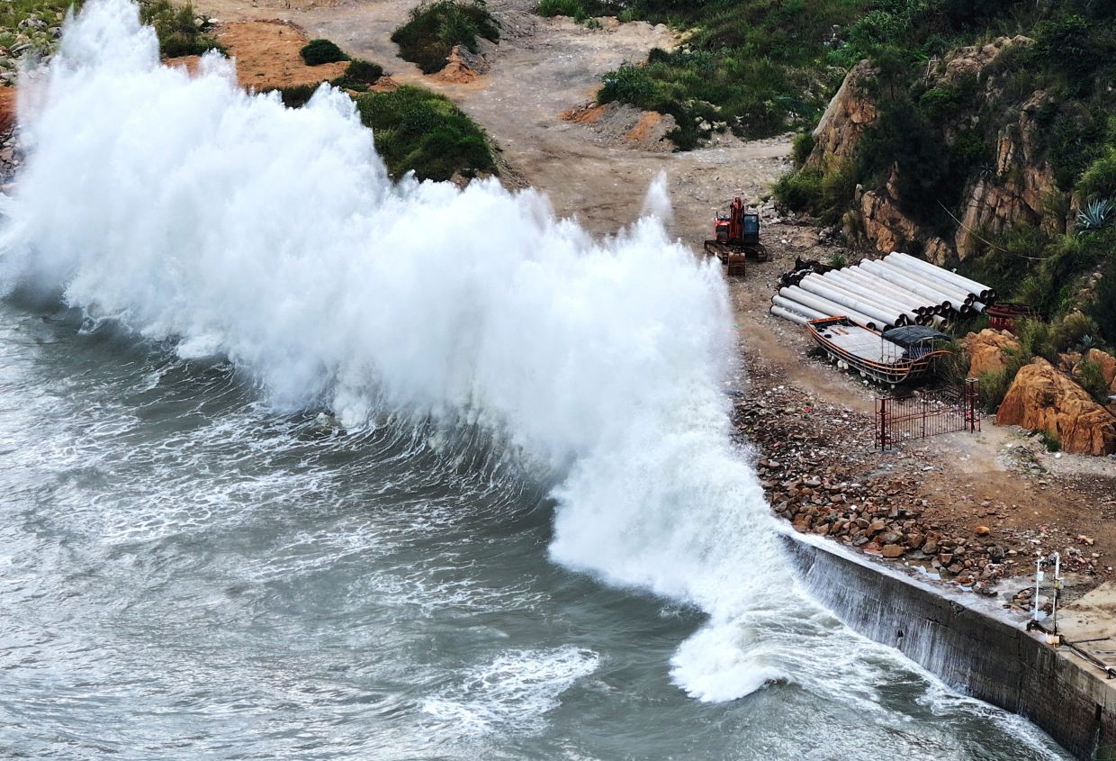 A drone view shows huge waves crashing on the coast of Huangqi as Typhoon Dolphin approaches in Huangqi town of Lianjiang, Fuzhou, Fujian province, China, on Sunday, August 9, 2026. -- Photo: cnsphoto via REUTERS