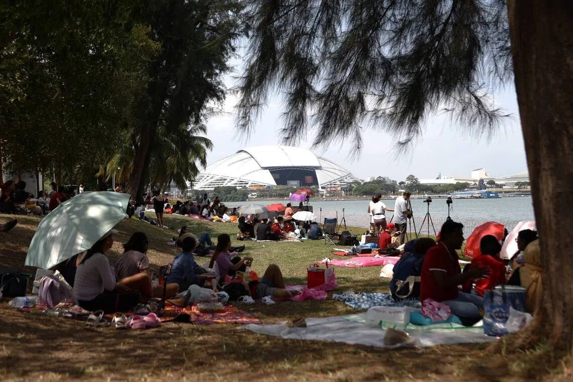 Members of the public preparing for the NDP festivities at Republic Avenue on Aug 9. - Photo: ST