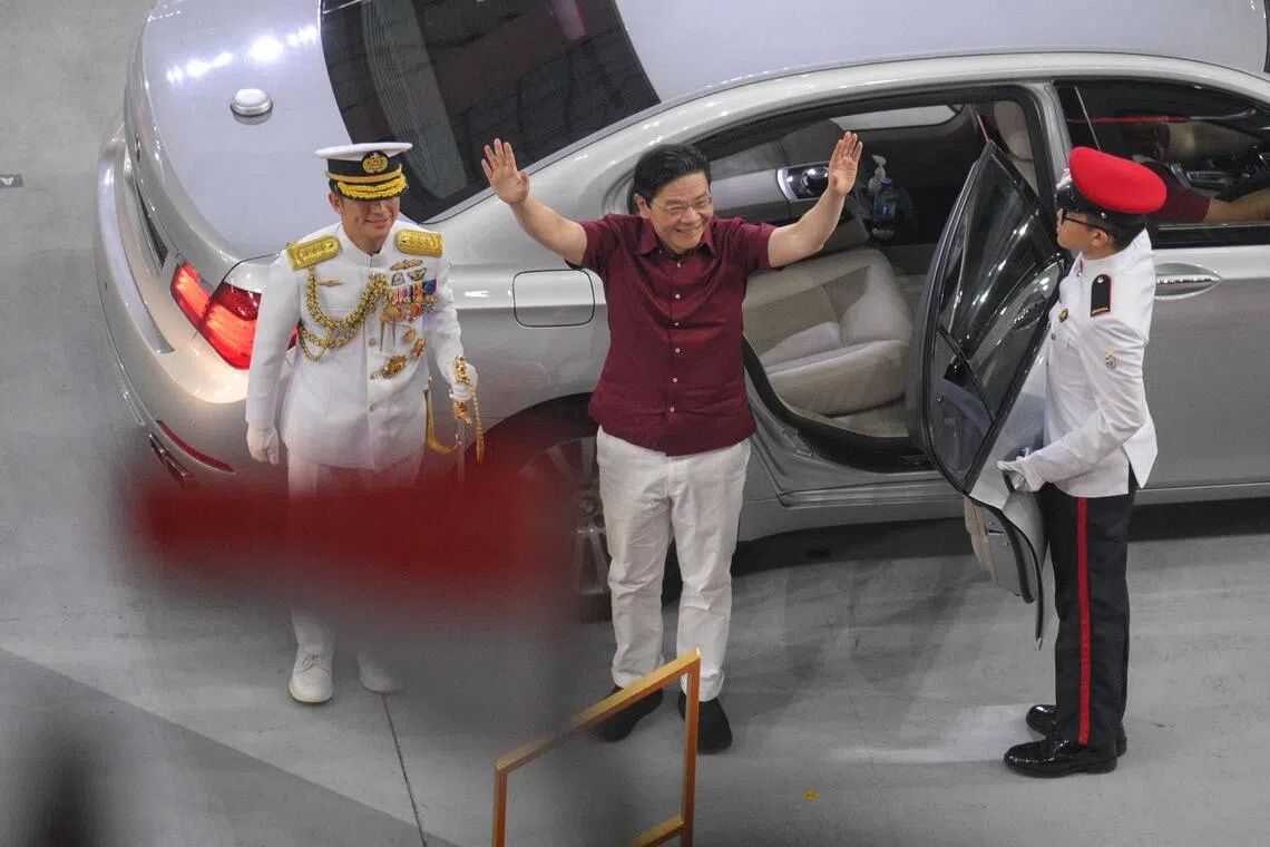 PM Lawrence Wong was greeted by rousing cheers as he entered the National Stadium. - Photo: ST