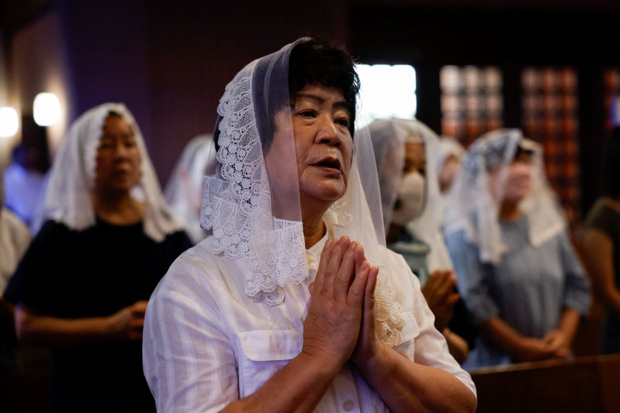 Residents attend a Mass at Urakami Cathedral in Nagasaki as they pray for the victims of the 1945 atomic bombing, on the 81st anniversary of the bombing, in Japan, Aug 9, 2026. - Photo: Reuters