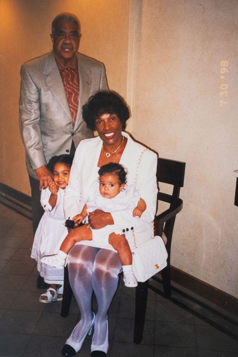 A photo of Olivia Joan Galli as a baby held by her grandmother Joan Johnson, with her older sister, Katja, and her grandfather in 1998. Photo: The New York Times