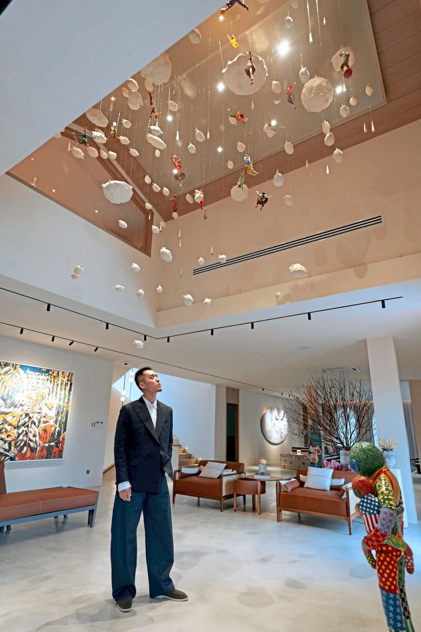 When designing his own home, Loo chose spaces that help him recharge and focused his home around his art collection, including this ceiling sculpture. Photo: Bryan Loo