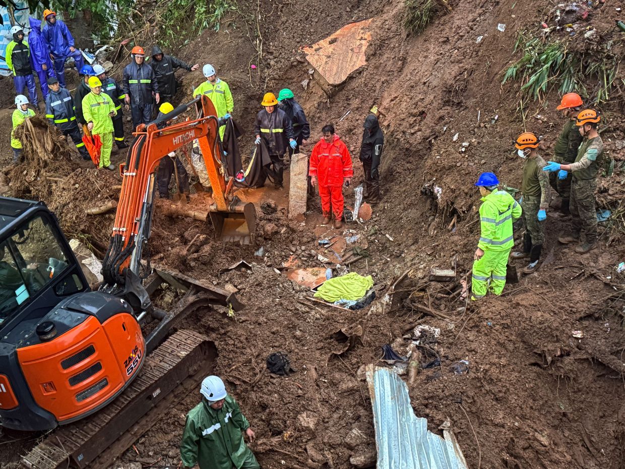 Rescuers continue search and rescue operations for missing residents a day after several houses were buried by a landslide due to heavy monsoon rains in Guisad Surong, Baguio City, northern Philippines, Monday, Aug 10, 2026. -- AP Photo/Harley Palangchao