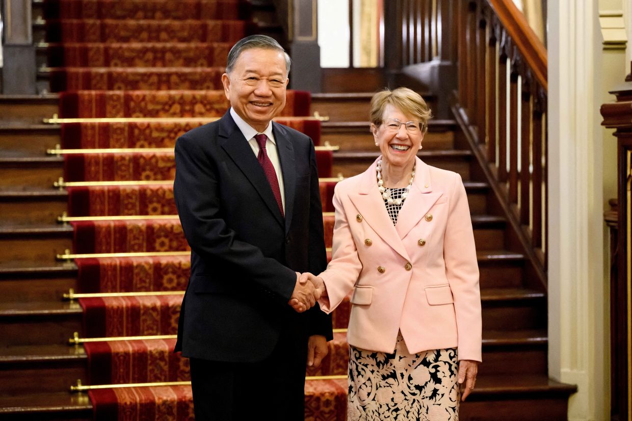 Vietnam’s President To Lam shakes hands with NSW Governor Margaret Beazley at Government House in Sydney, Australia, on Monday, August 10, 2026. -- Photo: Bianca De Marchi/Pool via REUTERS