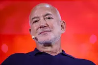 Soccer-Amazon founder Bezos nears deal to buy stake in Liverpool, reports say