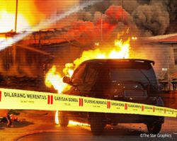 Woman escapes predawn car fire on Penang Bridge