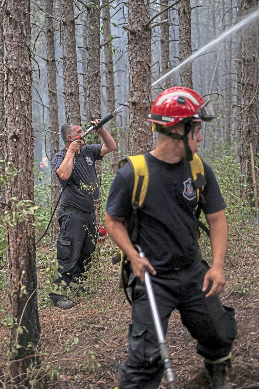 1. A firefighter battling a wildfire in Deliblatska Pescara, Serbia. Emergency services are tackling multiple blazes across the country as strong winds, extreme heat and prolonged drought fuel dangerous fire conditions. — Reuters