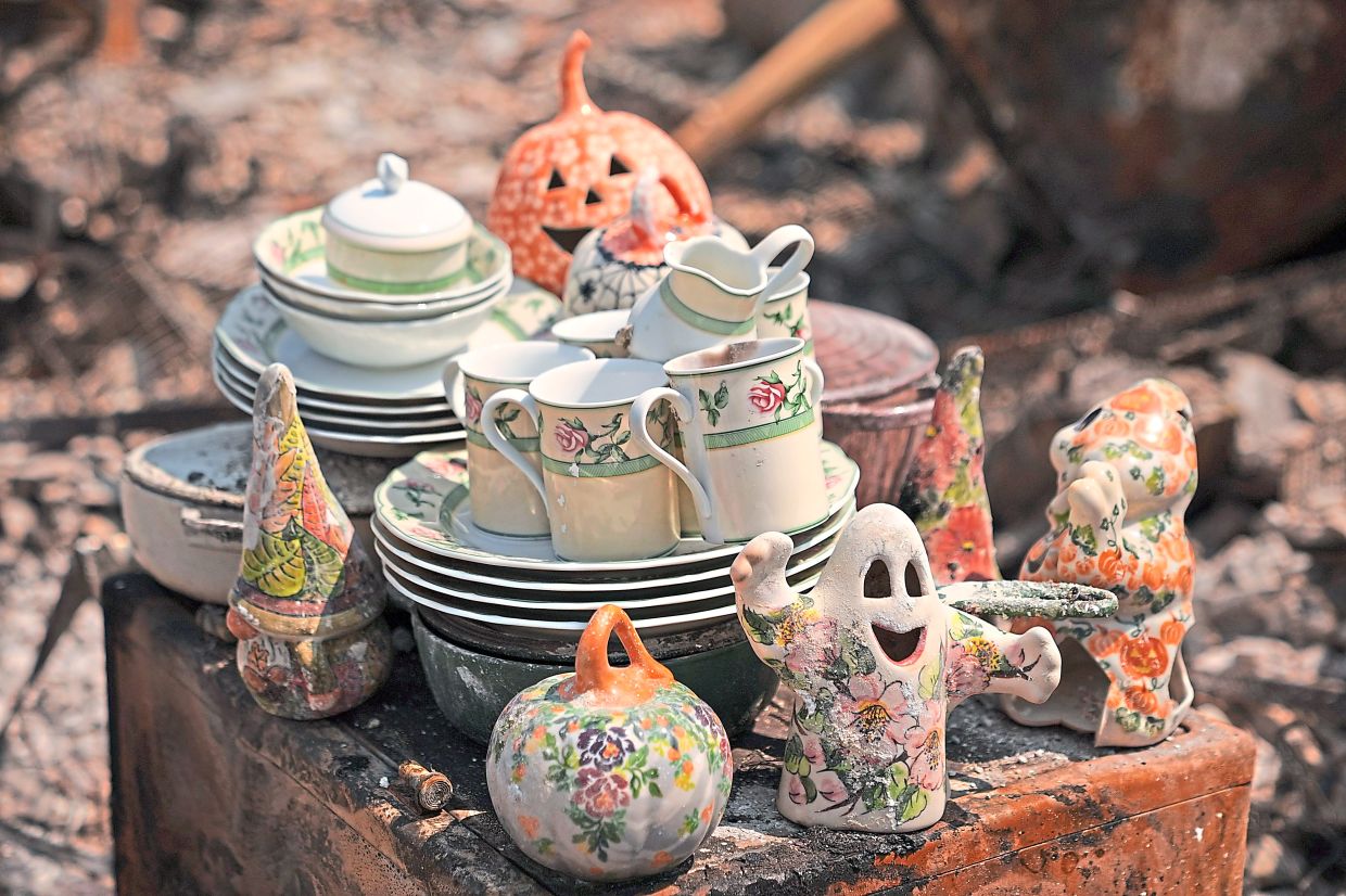 3. Piles of ceramic items are set aside at Donna Light’s former apartment after a wildfire swept through northwest spokane, Washington. Dangerous heat has gripped the United States as dozens of wildfires burn across the West. — AP