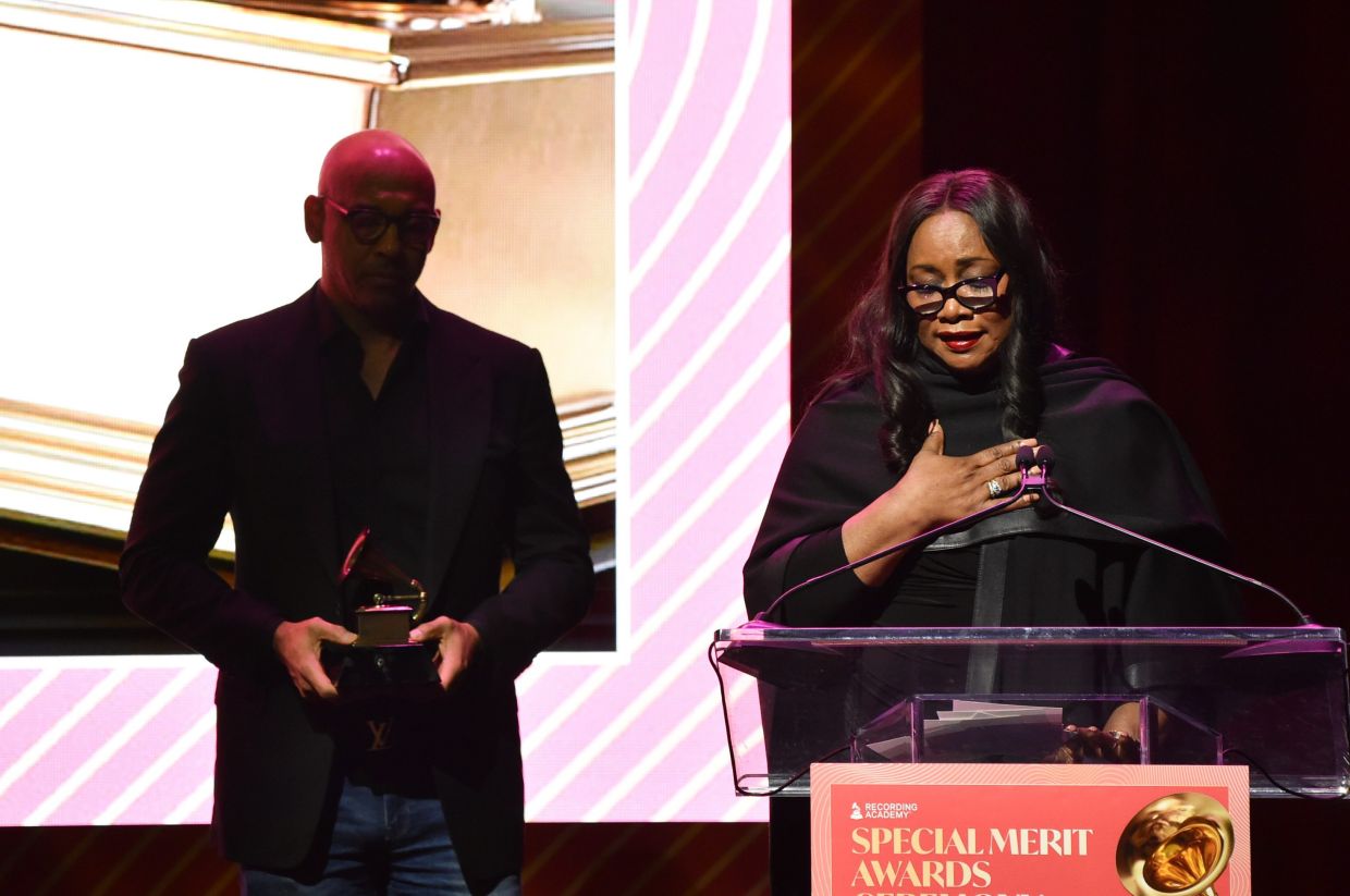 Pat Houston (right) accepts the lifetime achievement award on behalf of Whitney Houston during the Recording Academy's Special Merit Awards in Los Angeles on Jan 31, 2026. 