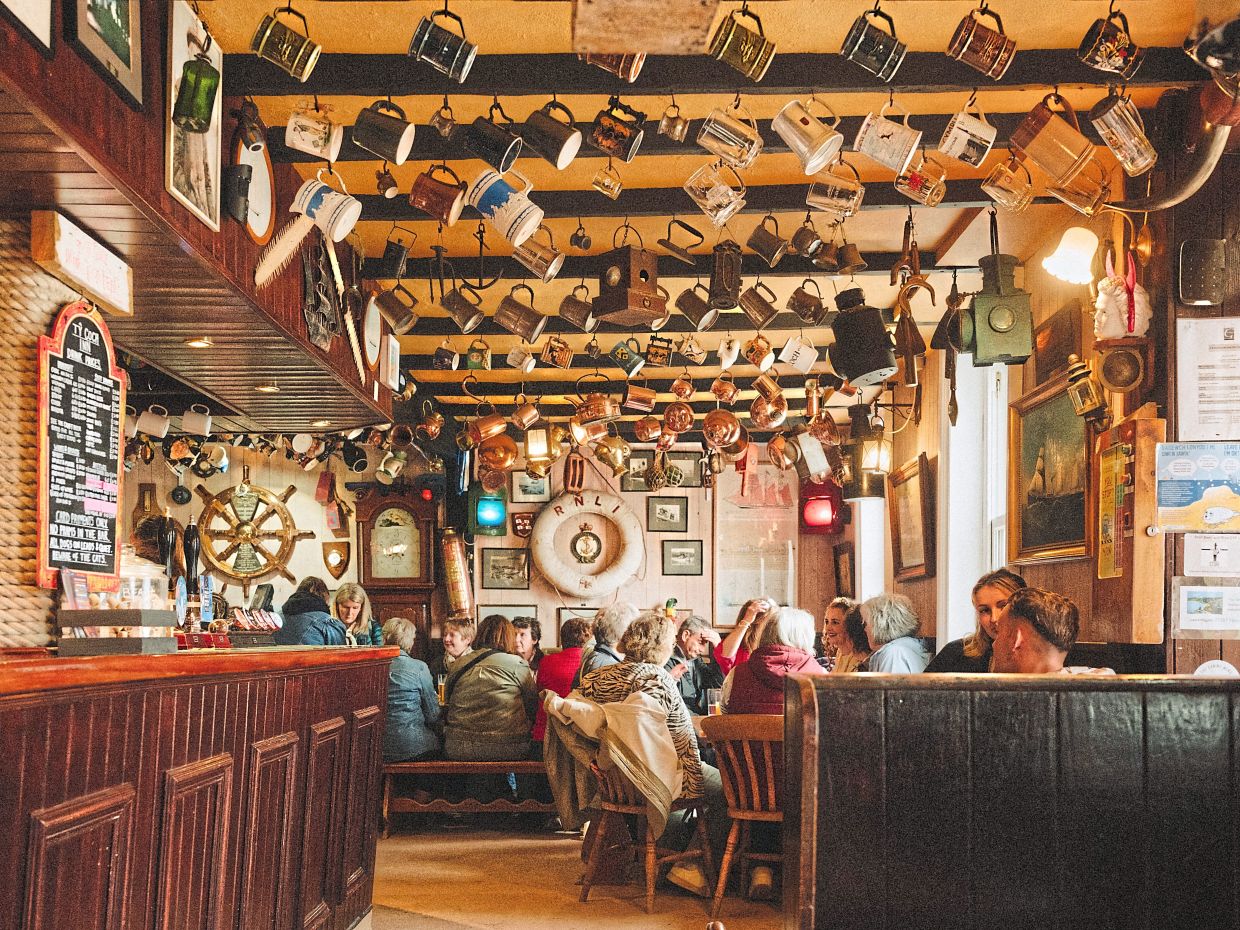 The pub at the Ty Coch Inn in the old fishing village of Porthdinllaen is popular with out-of-towners.