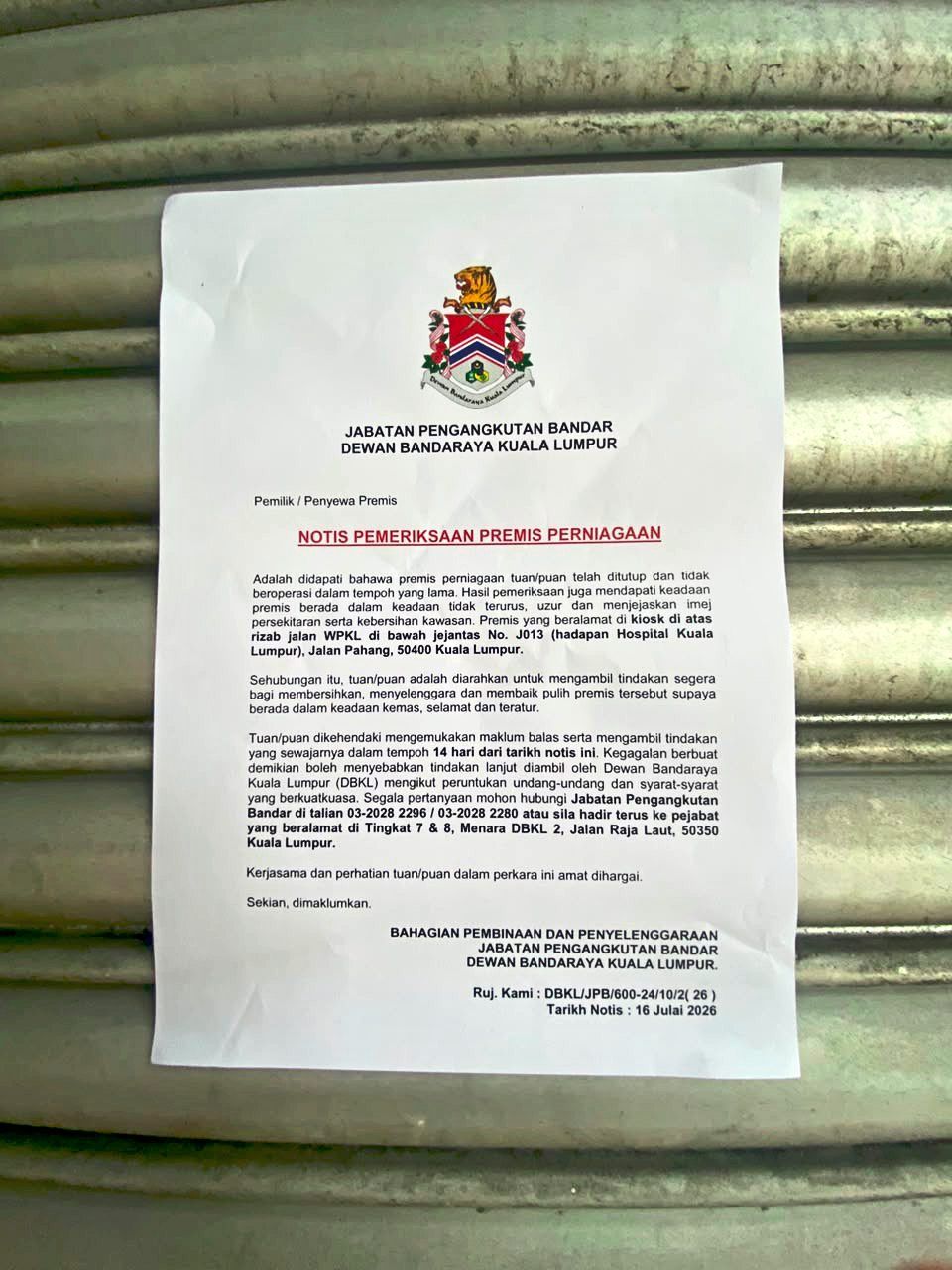 A DBKL Urban Transportation Department notice instructing the owner to clean up the kiosk.