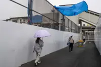 Tropical storm hits Tokyo area, leaving thousands without power before moving west
