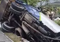 QuickCheck: Did a garbage truck crash through a condo’s wall into parked cars?