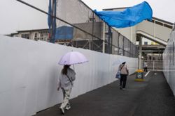 Tropical storm hits Tokyo area, leaving thousands without power before moving west