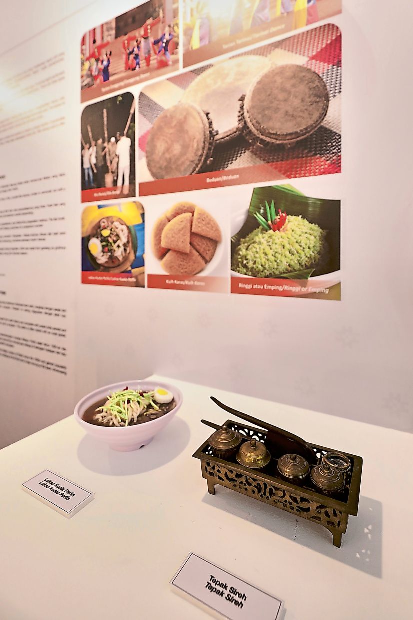 A Kuala Perlis laksa dish replica sits next to a ‘tepak sirih’ (right) denoting ceremonial traditions of Perlis, Malaysia’s northern-most state, at ‘Pameran Rona Jiwa Malaysia’ being held at the National Library until Sept 19.