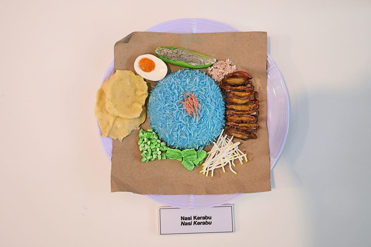 A replica of Kelantan’s celebrated dish, nasi kerabu, which gets its hue from the butterfly pea flower.