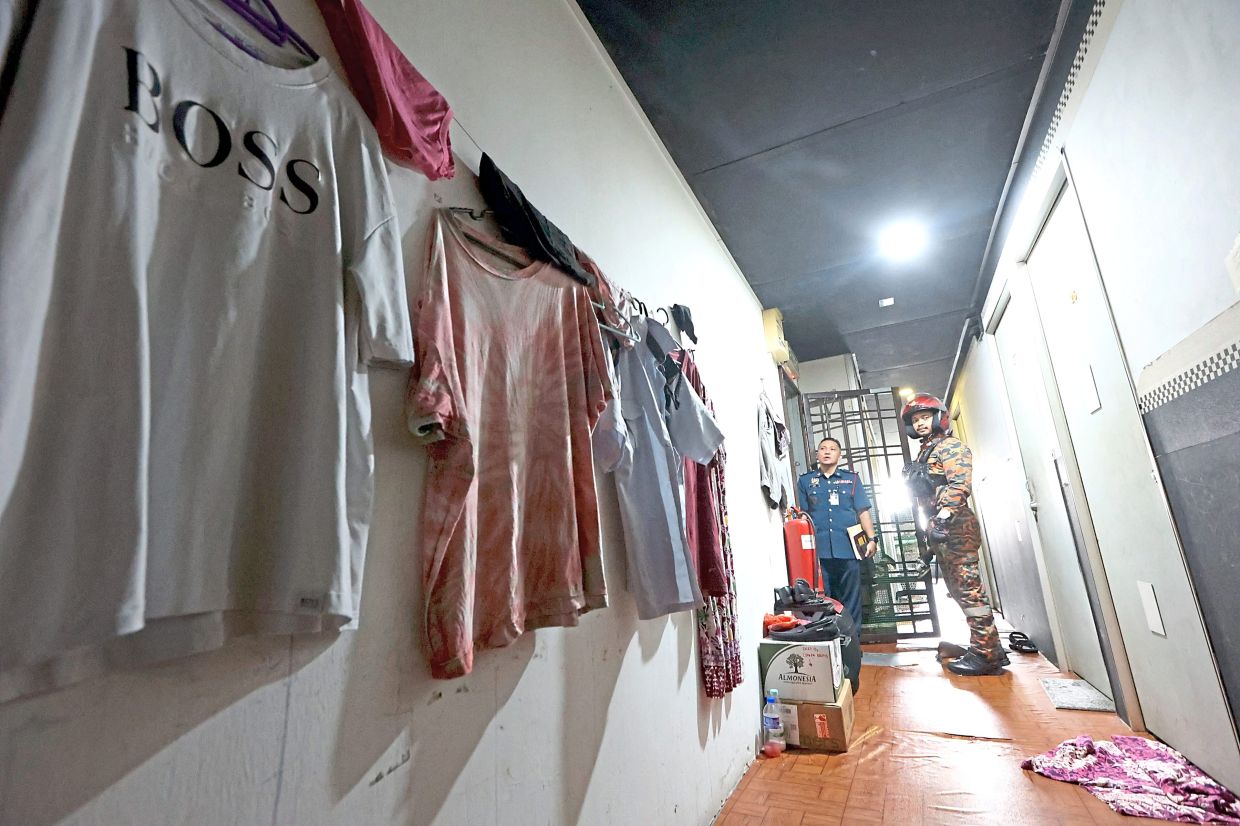 Authorities inspecting a bird’s nest hostel during an operation in Johor Baru.