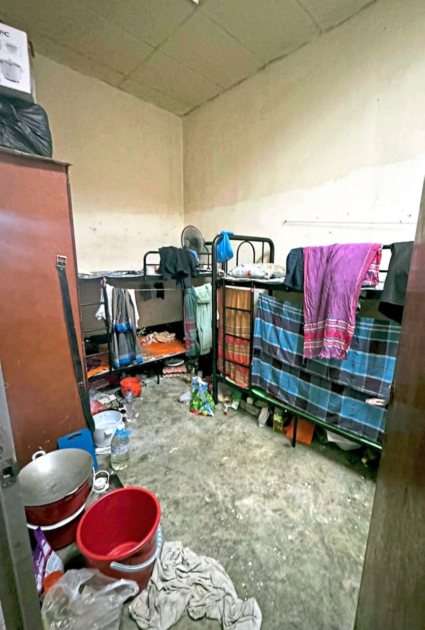 A cramped room at one of the illegal hostels. — Handout