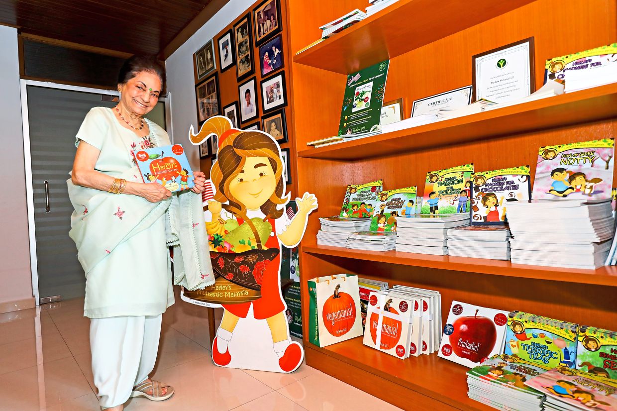 Her writing den is her sanctuary with shelves stacked with books, and some of the awards she’s won over the years.