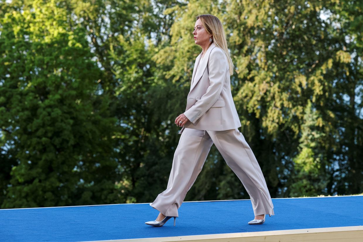 Giorgia Meloni walks during the official arrivals ceremony for the G7 summit in Evian-Les-Bains in France. Photo: AP