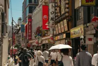 AC vests and UV parasols: East Asia deploys heat-fighting gadgets