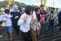 Rescuers search Lombok Strait for five missing after Bali ferry blaze