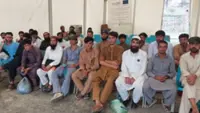 Nearly 900 Afghans released from Pakistani prisons return home