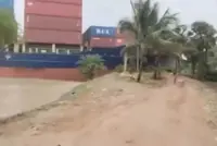 Singapore-registered container ship crashes into riverbank in India