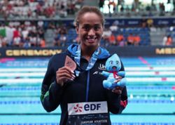 Swimming-Italy's Curtis takes McKeown's 50m backstroke world record