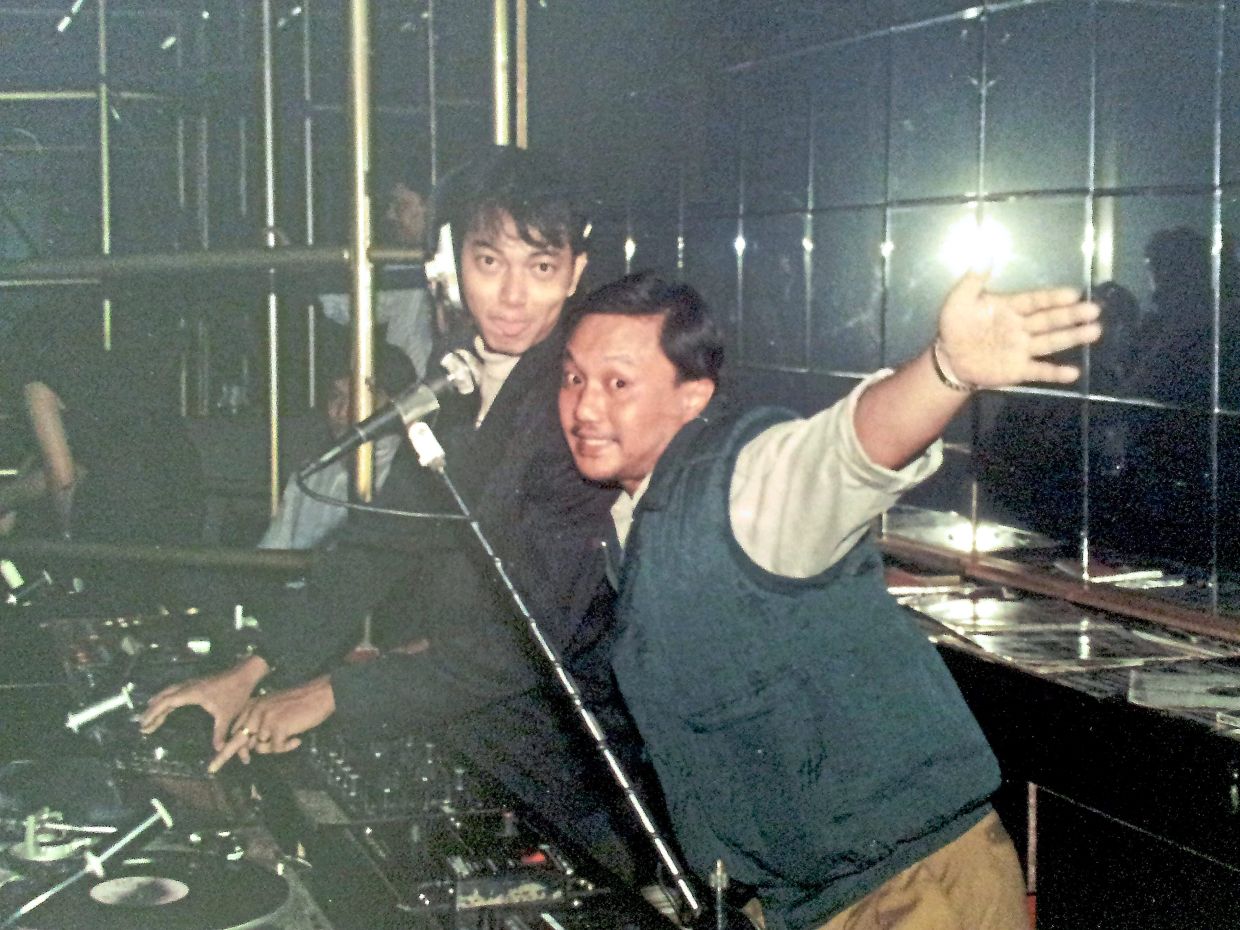 Young deejays Buenaventura (left) and DJ Kako fooling around at the decks in the earlier days. — Courtesy of DJ Kako