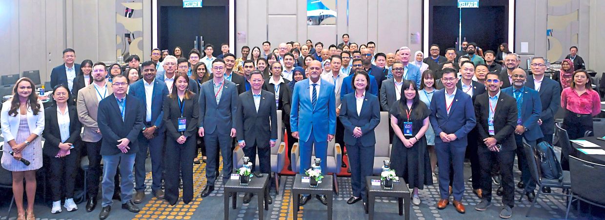 Future focused: Gobind (centre) and group chief executive officer of Star Media Group Chan Seng Fatt (on Gobind’s right) and chief operating officer Lydia Wang (on Gobind’s left) posing for a photo alongside organisers and participants at the CloudTech DataCentre conference 2026 in Kuala Lumpur. — RAJA FAISAL HISHAN/The Star