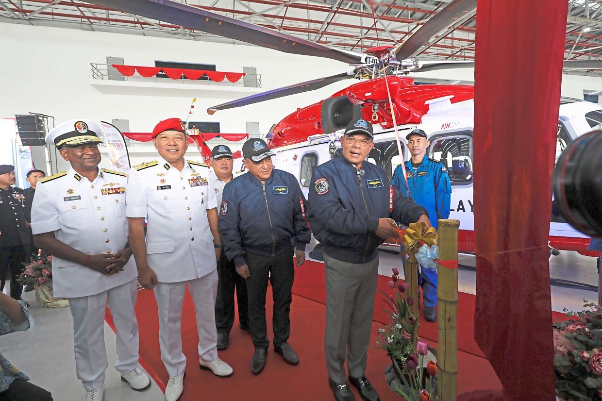 New arrivals: Saifuddin Nasution (right) at a ceremony to mark the delivery of the AW189 helicopters in Subang. — SAMUEL ONG/The Star