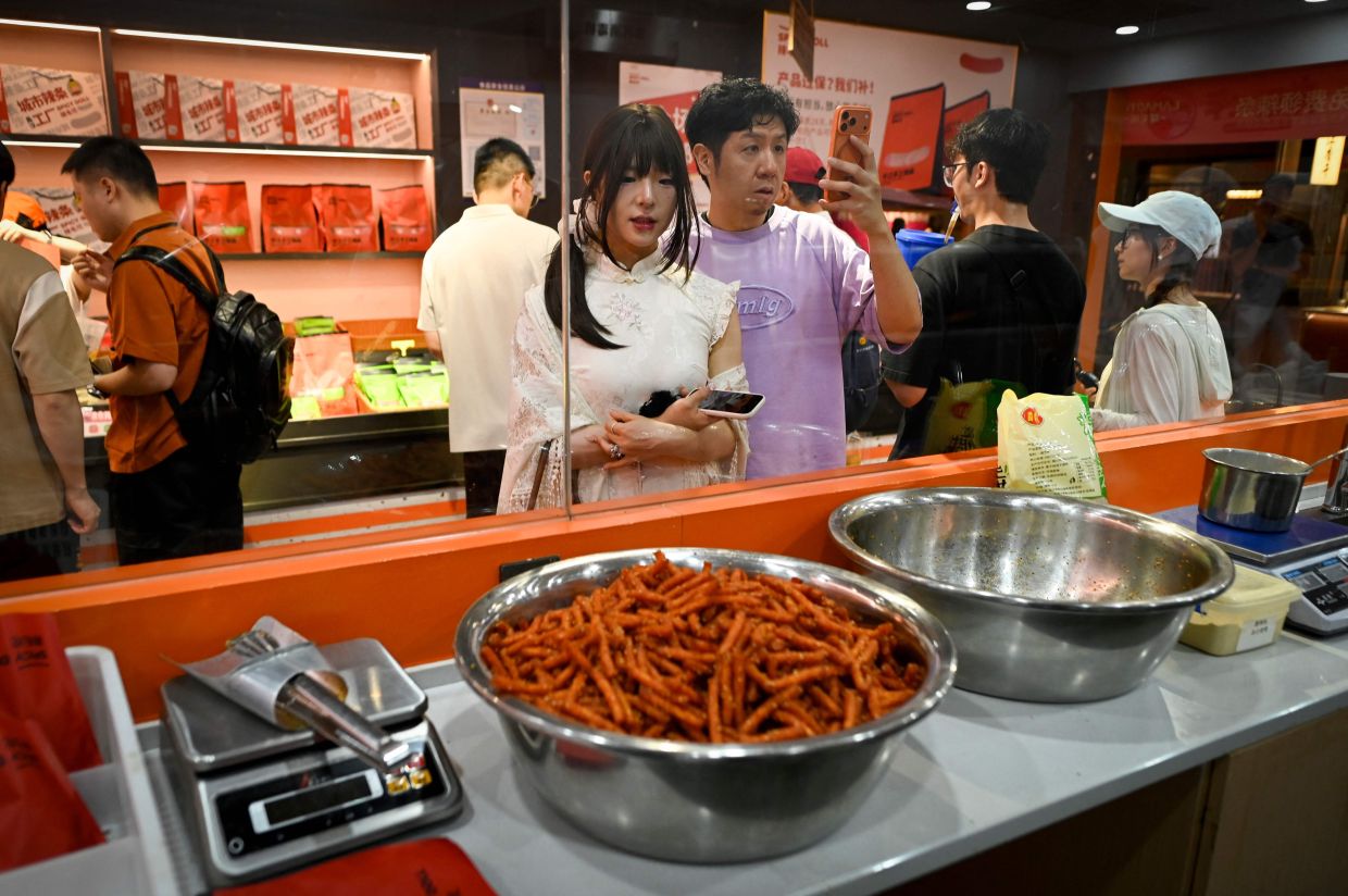 People visiting a spicy strips shop in Changsha, in China's central Hunan province.
