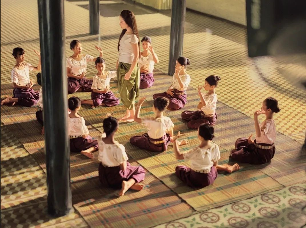 A scene depicting traditional dance instruction for young girls in the Vietnamese music video. - Photo: Supplied