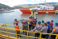 Search goes on for five missing in ferry blaze