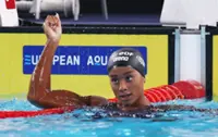 Swimming-Italy's Curtis betters own 50m backstroke world record