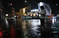 Thousands stranded at Japan's Narita airport after record rain kills four
