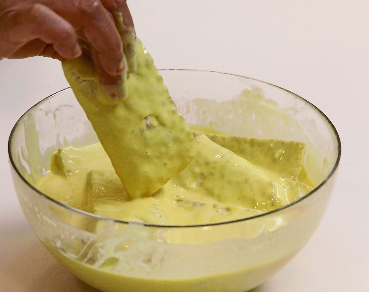 Dip the tempeh pieces intothe batter.