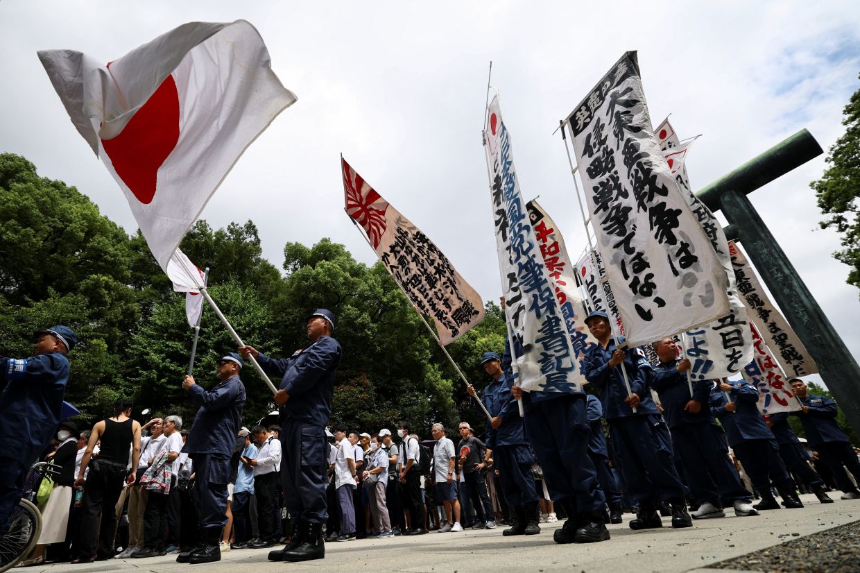 Japan defence minister visits war shrine, PM stays away