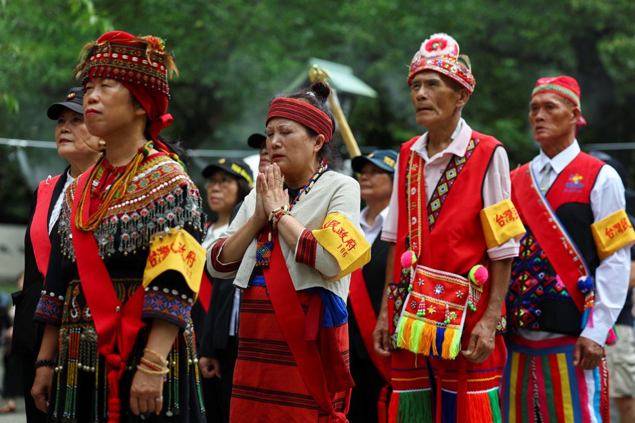 People from Taiwan wearing traditional costumes wait to pray during a visit to Yasukuni Shrine, to pay tribute to the war dead on the 81st anniversary of Japan's surrender in World War Two, in Tokyo, Japan, Aug 15, 2026. - Photo: Reuters