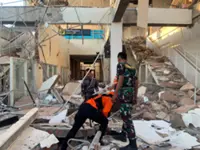 Magnitude 7.7 earthquake strikes off Indonesia's coast, toppling buildings and killing at least two