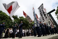 Japan defence minister visits war shrine, PM stays away