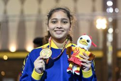 Putri claims second Sukma gold in new weight class