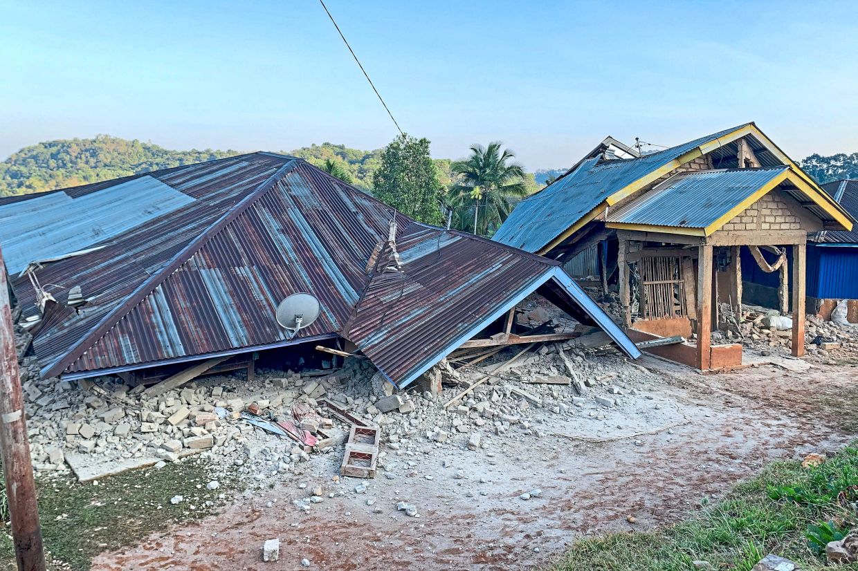 Deadly tumble: Many houses are damaged following the 7.7-magnitude quake in Ruteng, Manggarai, East Nusa Tenggara, that killed dozens. — AFP