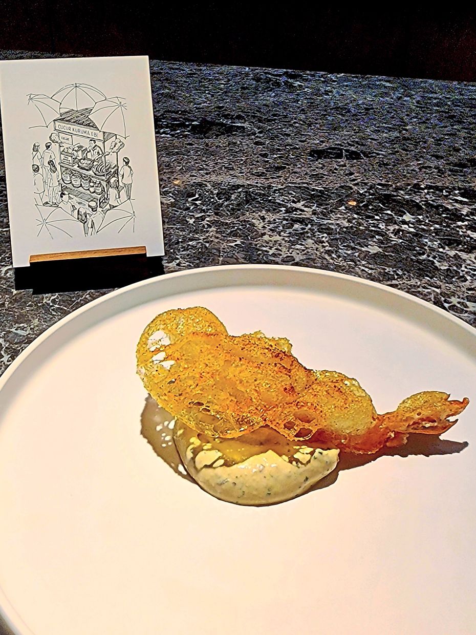 The cucur udang is a fabulous fried prawn dish enhanced with a funky budu cream cheese.
