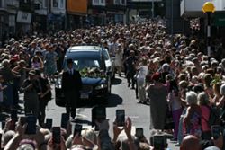 Bonnie Tyler fans line the streets of Welsh village as her coffin is brought home