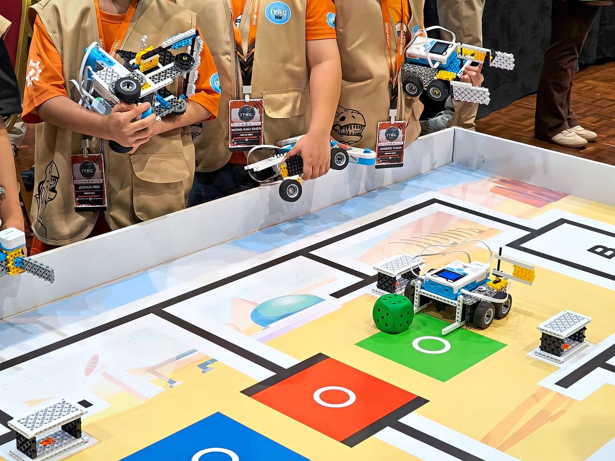 At IYRC 2026, participants had to get their robots to perform a series of challenges, including navigating obstacles and transporting objects like balls to designated checkpoints. — ANGELIN YEOH/The Star