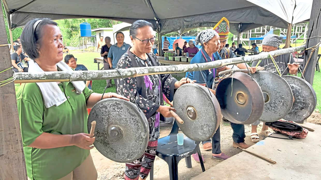 Participants playing traditional gongs during a cultural activity at PHOAS 2026. 