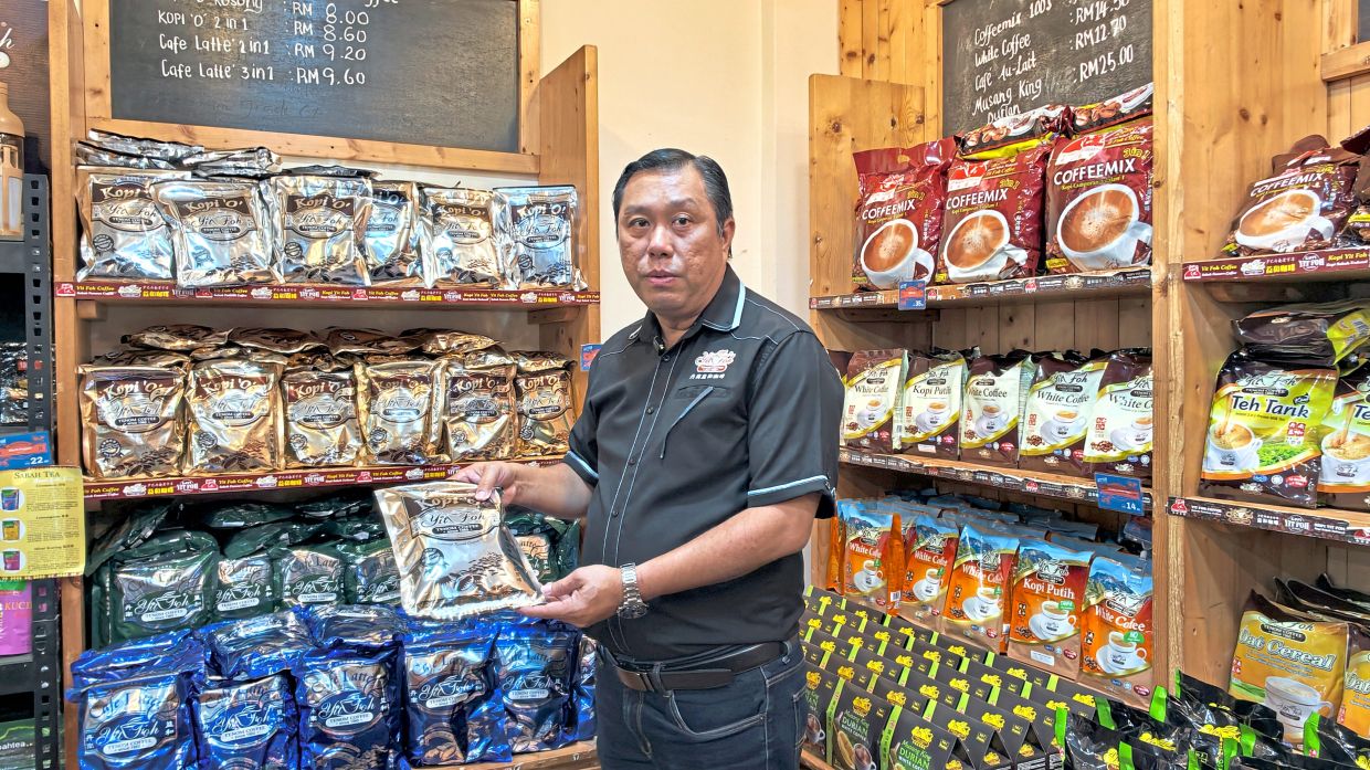 Yong with some of the Yit Foh coffee products now sold beyond Tenom.